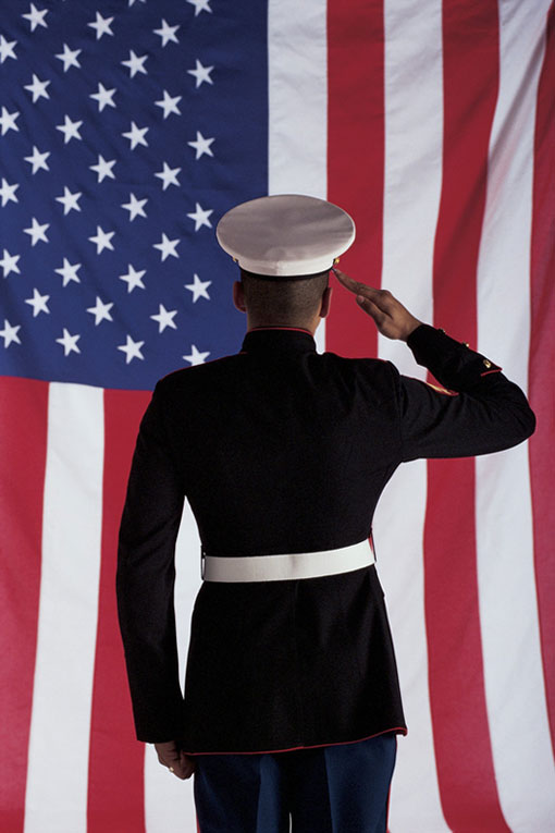 U.S. Marine saluting the American flag U.S. Marine saluting the American flag