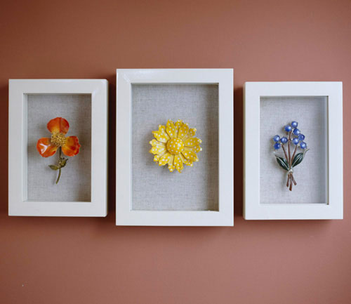 Simple, colorful vintage jewelry displayed in shadow boxes by Do It Yourself Ideas Magazine